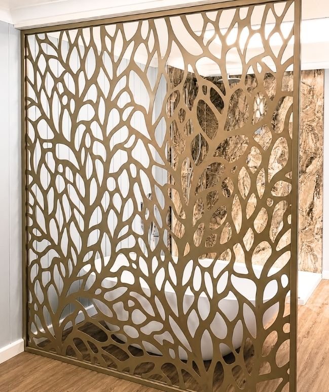 Laser cut bronze designer partition screen with organic leaf pattern