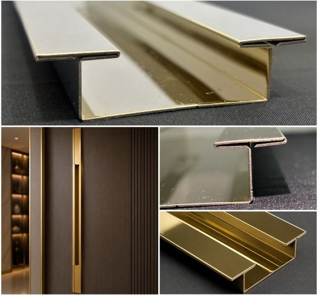 Gold PVD coated sculptural door handle profile on wood panel door