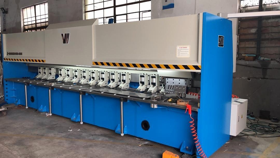 The CNC V-grooving machine in the Narela workshop, full length